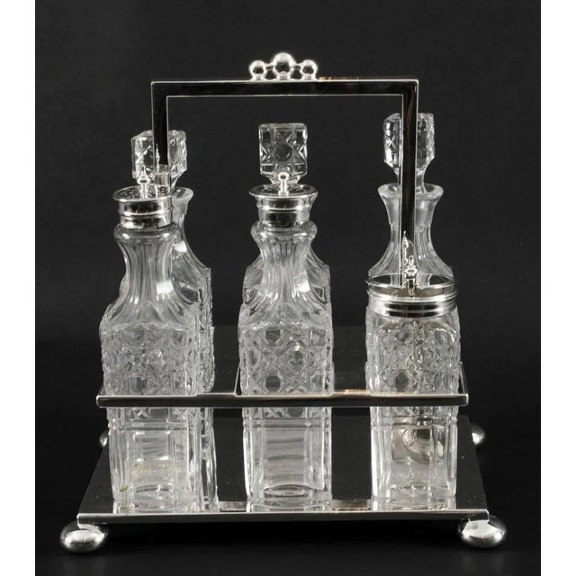 This is a gorgeous antique silver plated cruet set bearing the makers mark of the renowned silversmith Wade, Wingfield...