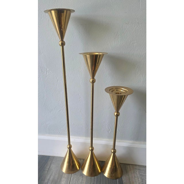 In this listing you will find a set of three candlestick holders done in bronze. Candlestick are in the style of Christian...