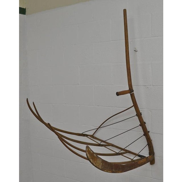 An advance on the single bladed scythe, the cradle scythe with its multiple curved tines or "fingers" enabled the user to...