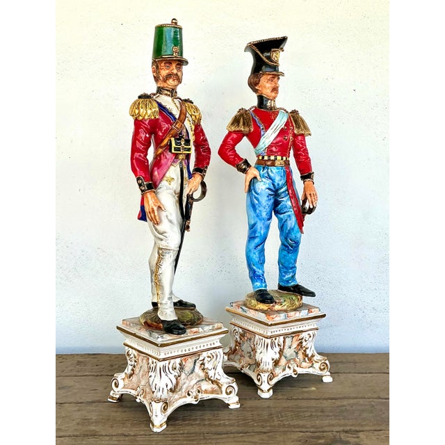 Infuse your interior with a sense of regal history and Italian artistry with this striking pair of vintage porcelain...
