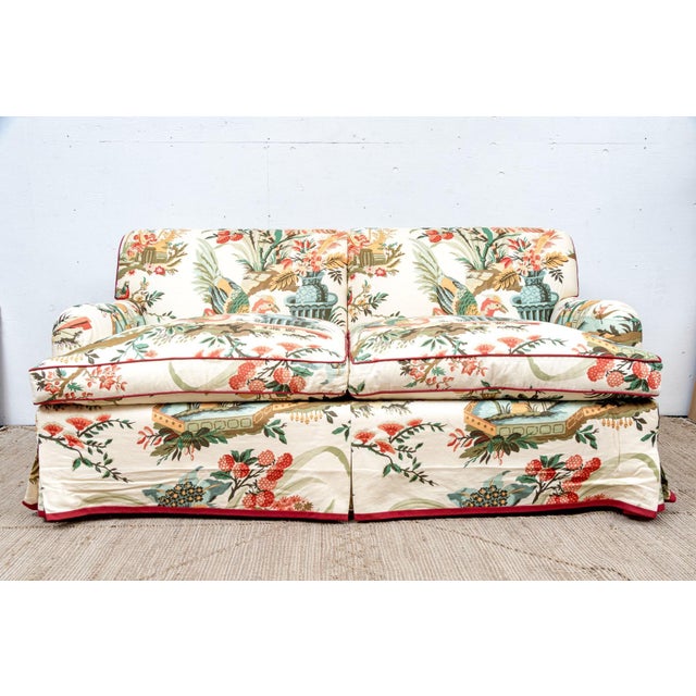 A fantastic custom upholstered loveseat sofa in Brunschwig and Fils "Le Lac". The sofa with an apron to conceal the...