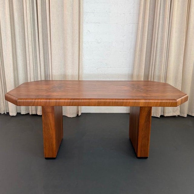 This striking Art Deco, double pedestal, burl walnut dining table showcases strong architectural elements. The table top...