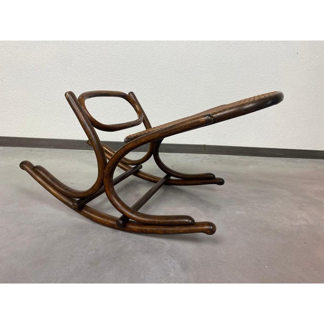 Thonet rocking footrest in very good original condition with signs of usage. This piece is attributed to the mentioned...