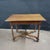 This French 19th Century Walnut Side Table With X-Stretcher, Turned Legs & a Drawer has such a pretty finish to it. The...