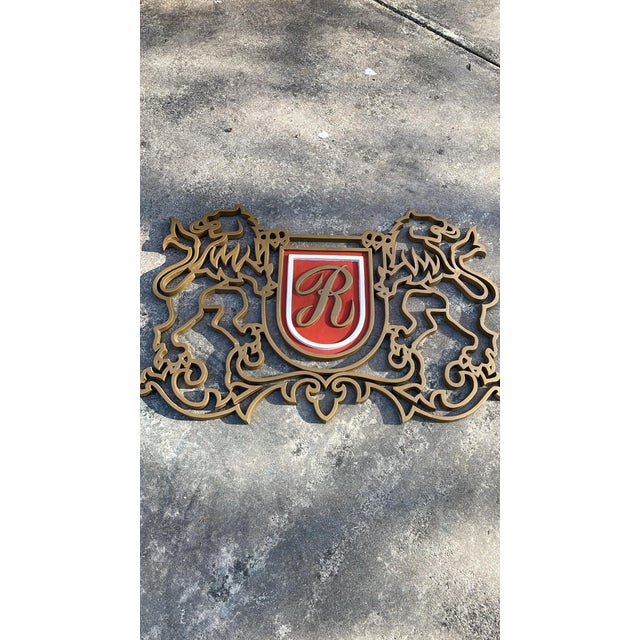 Large solid metal British Rothman’s tobacco sign. Ornate lion details on either side. Sign is heavy. This would look great...