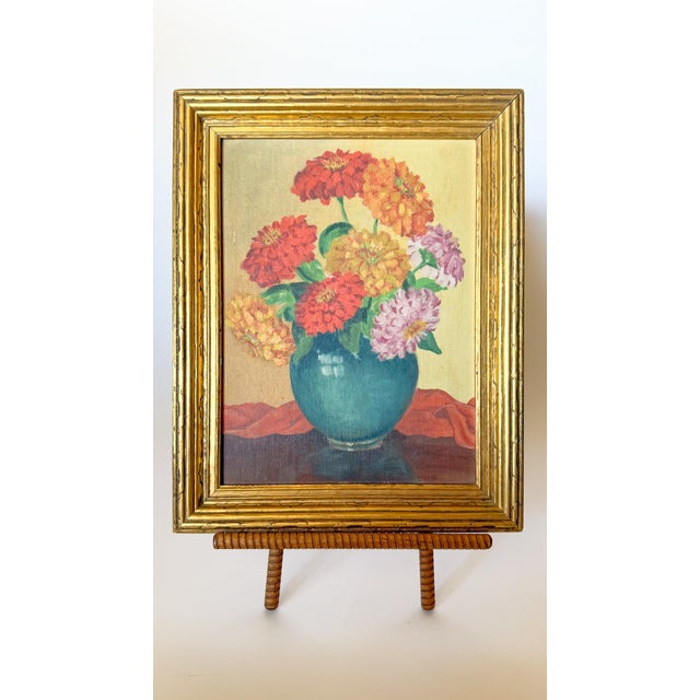 The most charming floral still life, painted in 1939. It features colorful zinnias in a dark teal vase with a scarlet...