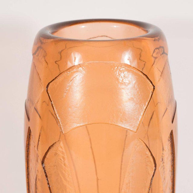 This elegant vase was realized by the illustrious glass making atelier, Charder, in France, circa 1930. Executed in...
