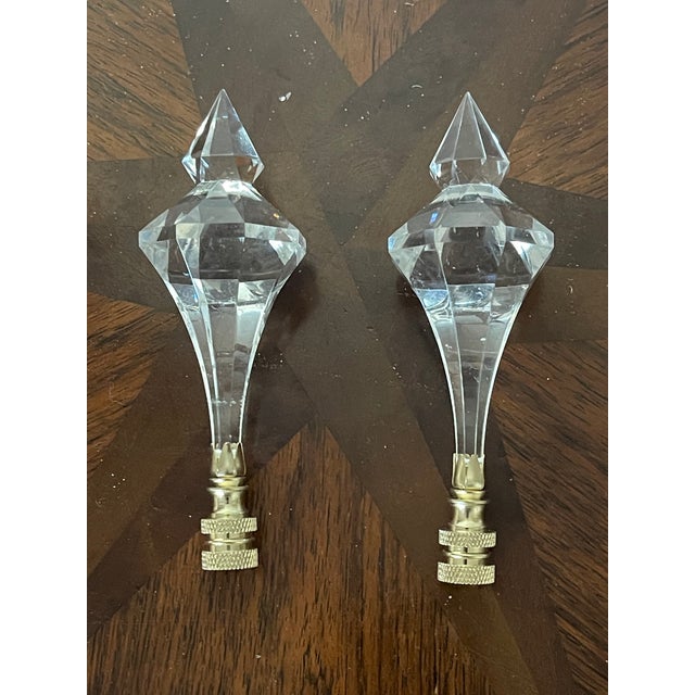 Vintage pair of lamp finials lucite icecles on brass basis.