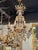 This 19th century French Baccarat-inspired bronze and crystal chandelier exudes elegance and sophistication. Featuring...