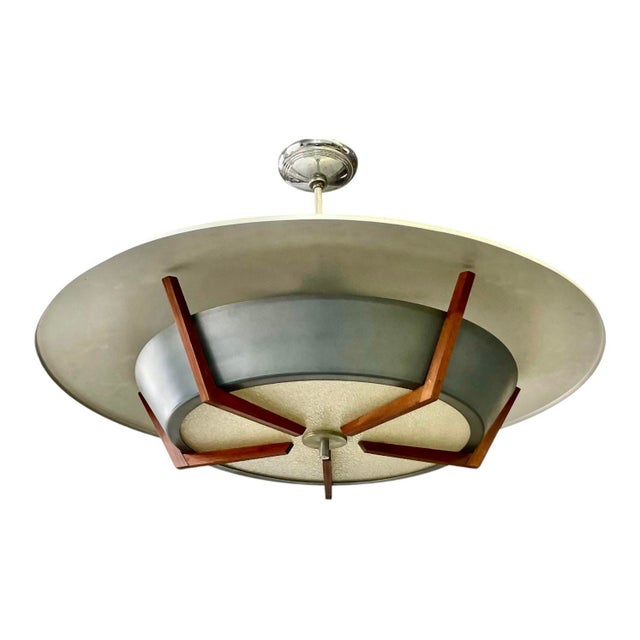 This monumental 1950s “flying saucer” pendant light is a showstopper! A blackened aluminum “bowl” with textured...