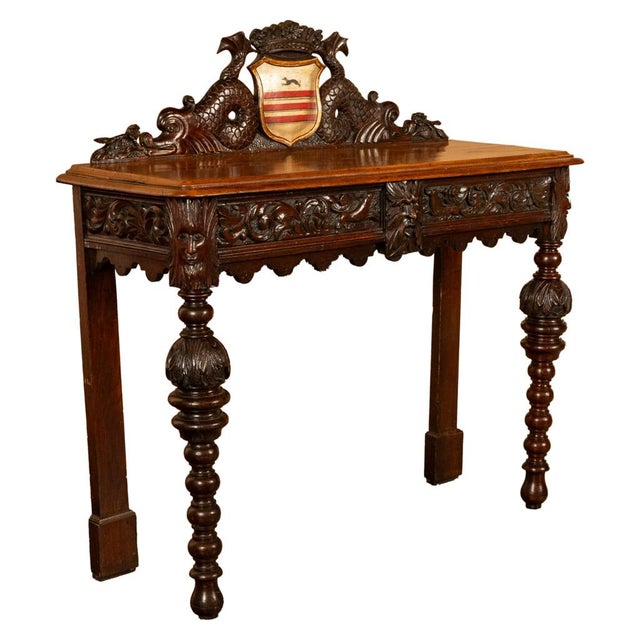 A fine & rare antique carved hall table, with the Skipworth Family coat of arms, circa 1860. The table is very finely...