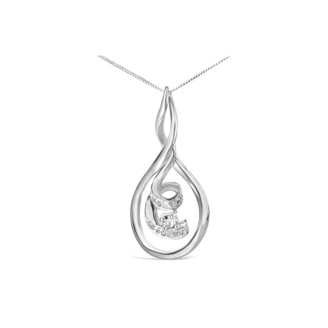 With a wide outer ring that beautifully surrounds the cascade of spirals inside, this exquisite white gold and diamond...