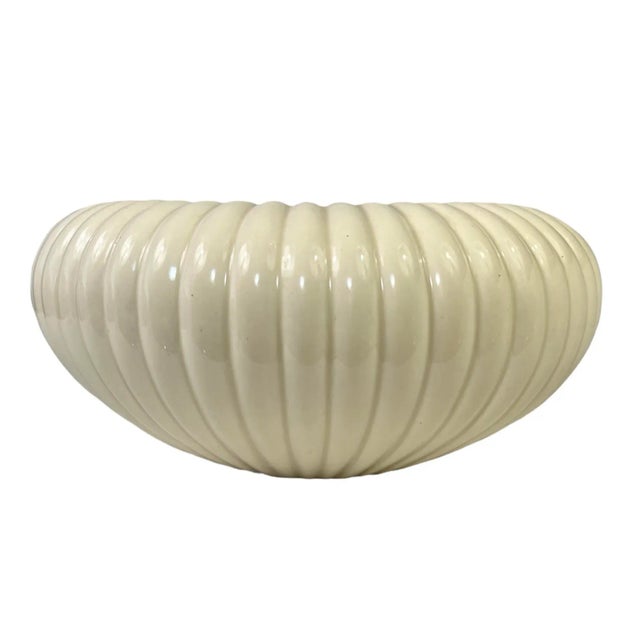 Add a charming vintage touch to your decor with this quality early 1970s fluted bowl by Freeman McFarlin Potteries. This...