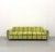 A bold vintage postmodern sofa featuring a polished aluminum frame paired with vibrant striped upholstery in shades of...
