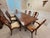 A magnificent eleven-piece dining ensemble by Nicholas James Ltd., the prestigious London-based Custom English Cabinet...