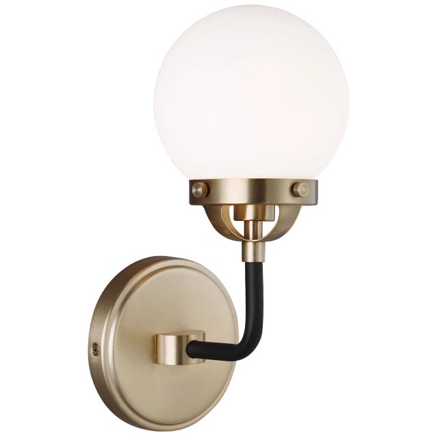 The Cafe one light vanity fixture in satin brass offers shadow-free lighting in your powder room, spa, or master bath...