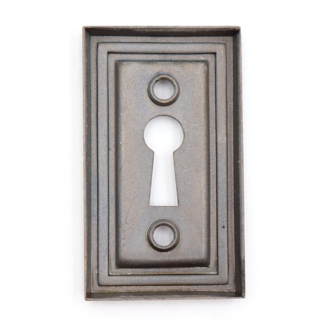 Vintage Art Deco style rectangular shaped keyhole cover plate made of steel with an antique brass finish. The original...