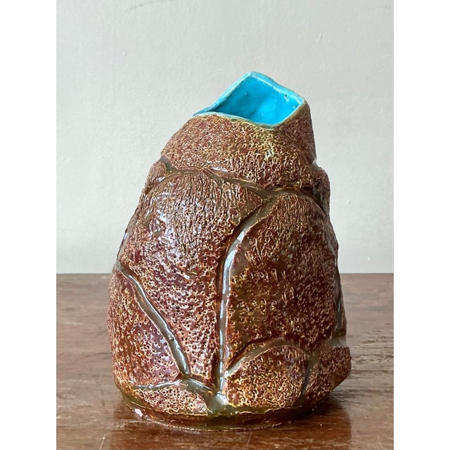 This striking vintage studio pottery vase embodies the free-spirited aesthetic of Bohemian design, featuring an...