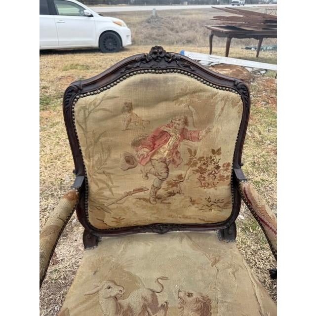 Large Pair of French Louis XV Armchairs from France made of solid walnut, the wood has been finished with a lustrous...