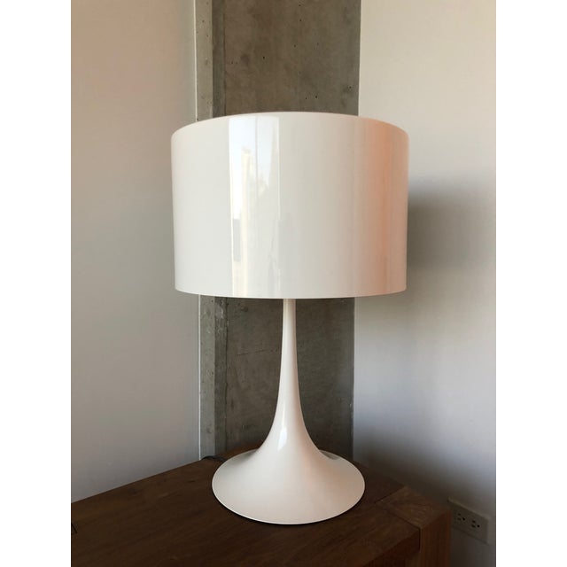 Designed by Sebastian Wrong in 2003, the Spun Light-T table lamp reflects the best of modern manufacturing technology...
