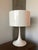 Designed by Sebastian Wrong in 2003, the Spun Light-T table lamp reflects the best of modern manufacturing technology...