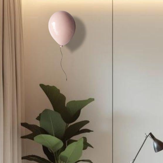 Add a unique sense of individuality into your space with this ceramic light pink balloon wall sculpture. Handcrafted from...