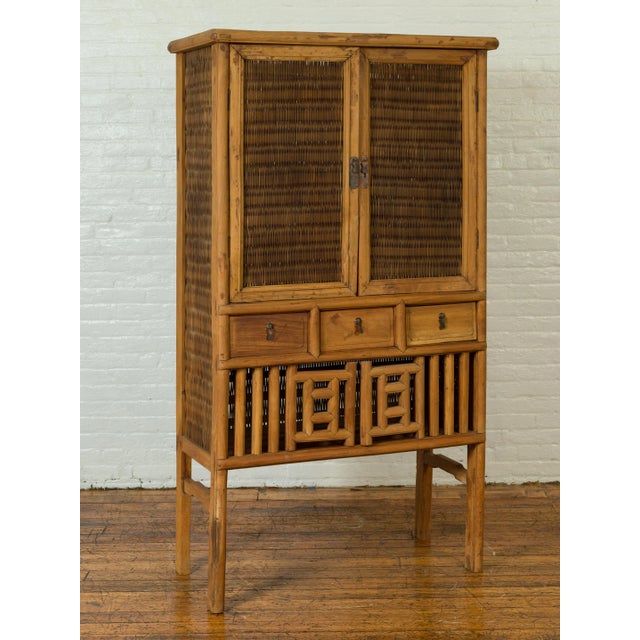 Early 20th Century Indonesian Cabinet with Rattan Doors, Drawers and Fretwork Sliding Panels For Sale - Image 5 of 13