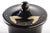 This black urn is a glossy black cup vase with lid and floral motive, realized in Germany between 1940s-1950s. In...