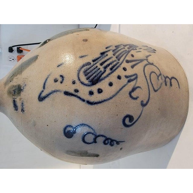 Original hand decorated stoneware jug with folky exaggerated bird. Great condition. Glaze drip on the sides. This jug is a...