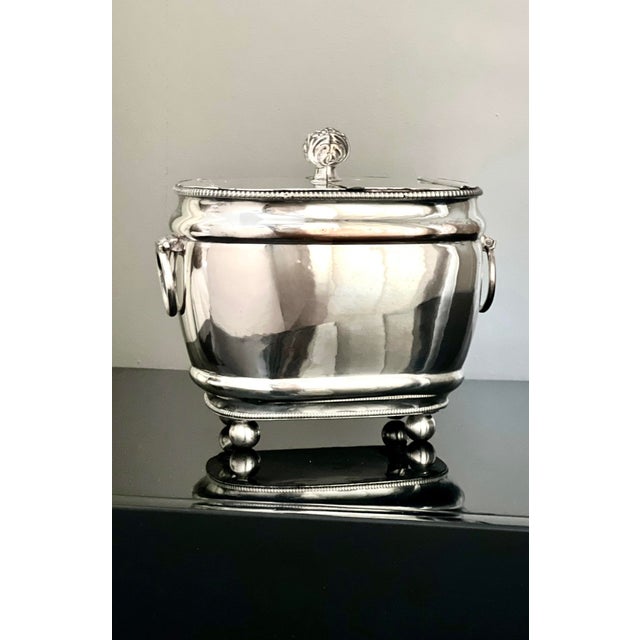 Charming 19th century George III silverplated tea caddy. A well-formed, rounded rectangular body with gadrooned trim and...
