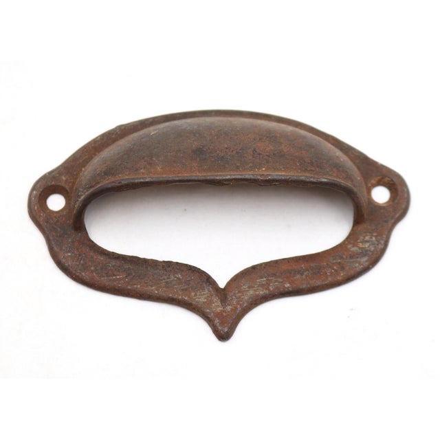 Antique cast iron drawer bin pull with a black and rust finish. The original mounting screws are not available. Good...