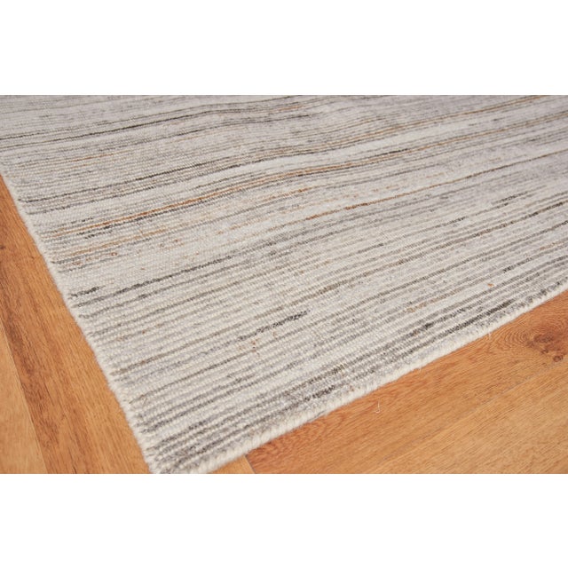 By using contrasting multi-color in this subtle striped pattern, the subdued pops of the accent colors give a nice twist...