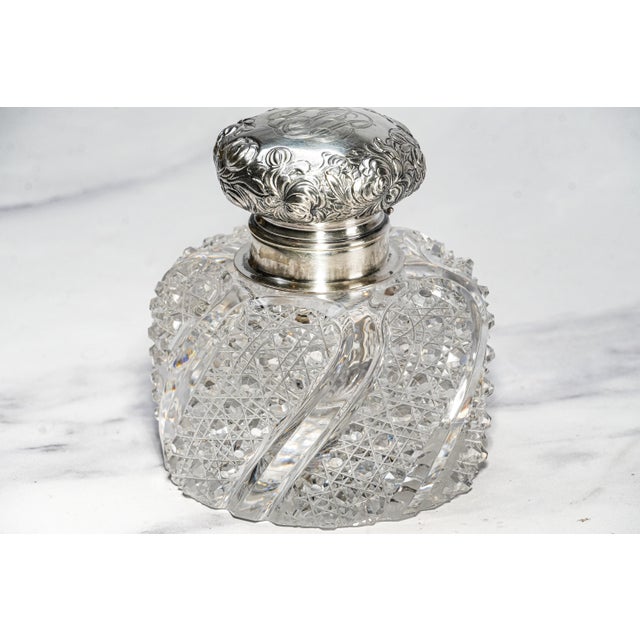 A magnificent example of Victorian luxury and craftsmanship, this large antique cut crystal inkwell is a true statement...