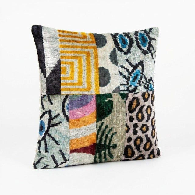 This unique 20'' x 20'' Ikat Patchwork pillow cover combines multiple authentic Uzbek silk velvet ikat fabric pieces in a...