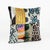 This unique 20'' x 20'' Ikat Patchwork pillow cover combines multiple authentic Uzbek silk velvet ikat fabric pieces in a...