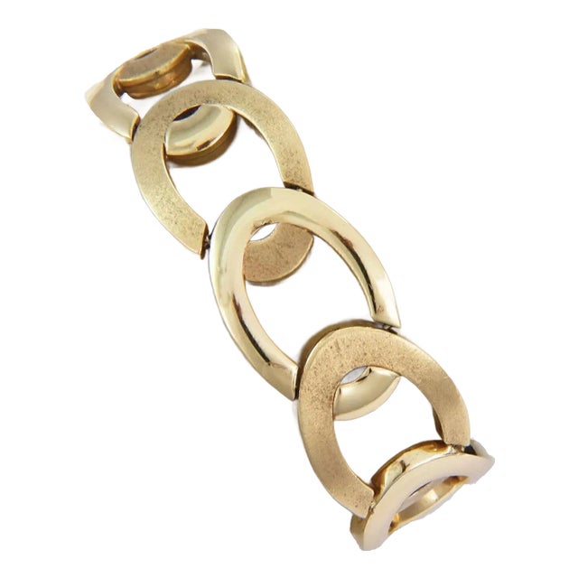 This is a beautiful bracelet, it is crafted from 14k yellow gold with a polished and textured finish featuring interlaced...