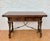 Beautiful Spanish drop-leaf table crafted from wood, featuring a traditional design with richly carved details and a...