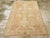 An antique Indian Agra accent rug. Indian rugs often have peculiar iconographies. Here roosters are paired in the heart-...