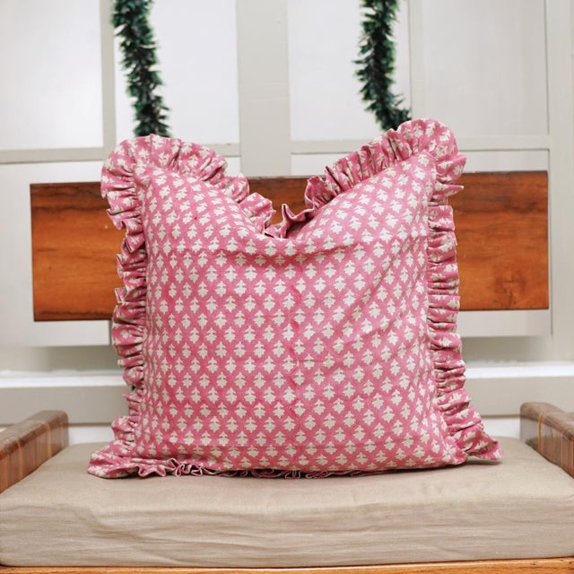 Add a touch of handcrafted elegance to your home with the Fabdivine Pinkcity Bhoomian Handcrafted Block Print Frill Pillow...