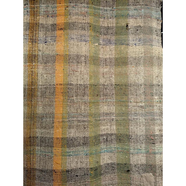 A quiet and enduring piece of Anatolian craftsmanship, this vintage Turkish kilim runner was handwoven during the third...