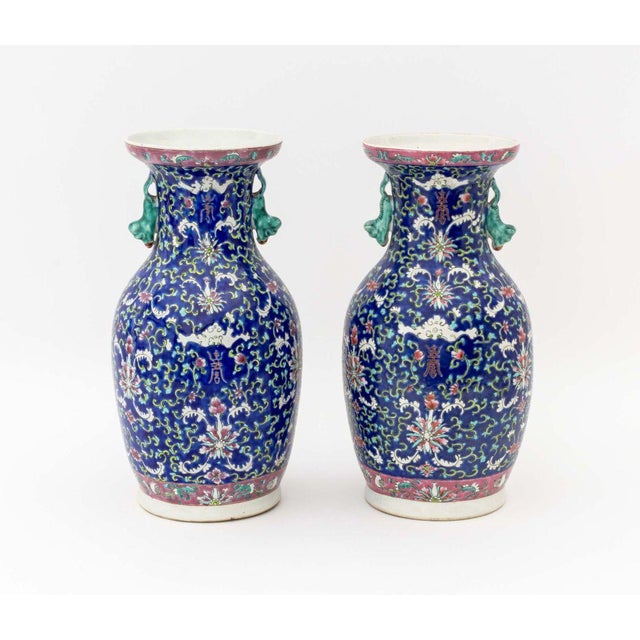 Pair of Chinese Famille Rose Porcelain Baluster Vases, each hand-enameled with si bat and scrolling floral motif on a...