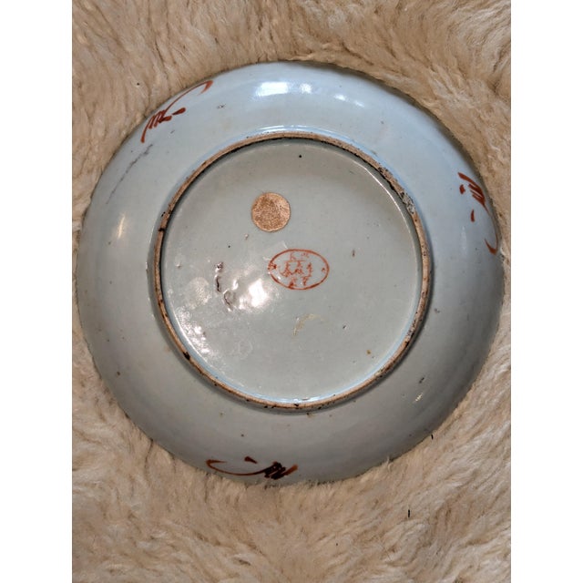 A distinguished antique Chinese export porcelain saucer dish, 8.5 inches in diameter, hand-painted in the Famille Rose...