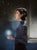 Nightfall by Sara Scribner | Oil on Aluminum Portrait of a woman holding a glowing light. For Sale