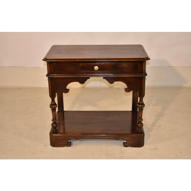 Late 19th century oak console or side table from England. This is a great form with a lower shelf and such interesting...
