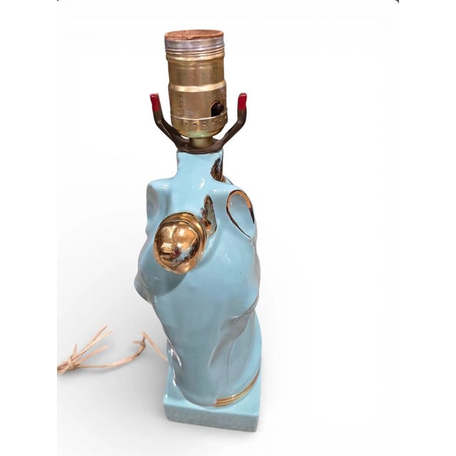 This charming vintage unicorn lamp showcases the whimsical design aesthetic of the 1950s. Crafted from high-quality...