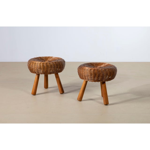 An exceptional and highly collectible pair of mid-century modern three-legged stools (frequently utilized in modernist...