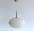 Mid century vintage cocoon pendant light with a flattened composite acrylic globe shade with diamond relief patterns and...