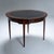 Round table with a moulded table top and a mahogany veneered frame. The table stands on square tapering legs with brass...