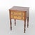 This antique Sheraton sewing table, dating to approximately 1830, showcases a combination of tiger maple and cherry wood....