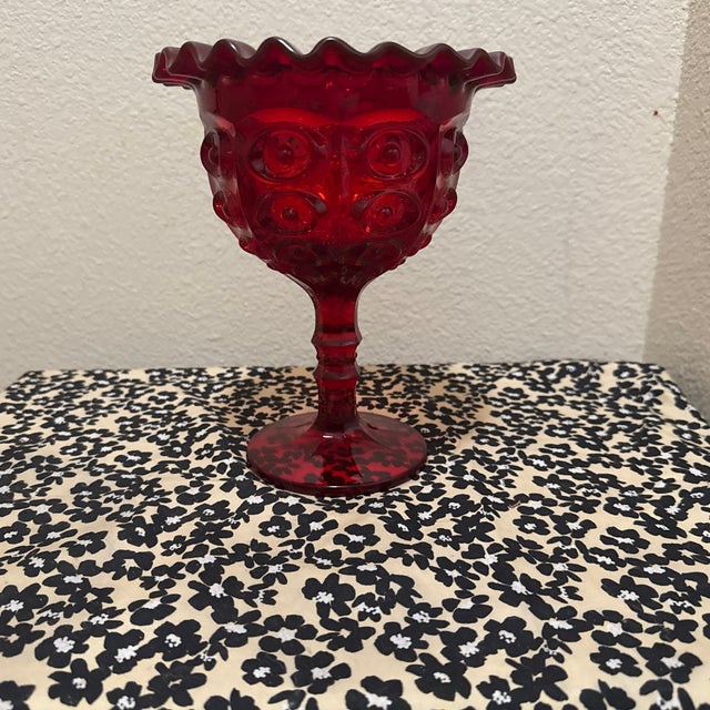 This stunning Viking Glass Bullseye Yesteryear Ruby Red Ruffled Pedestal Compote Bowl is a quintessential piece of Mid-...